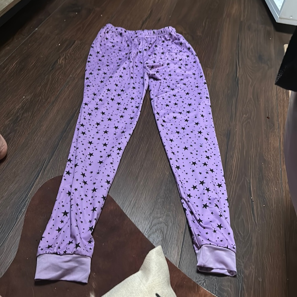 Purple pajama pants with black stars